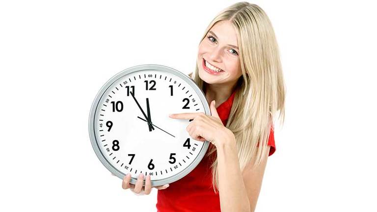 Woman pointing at clock